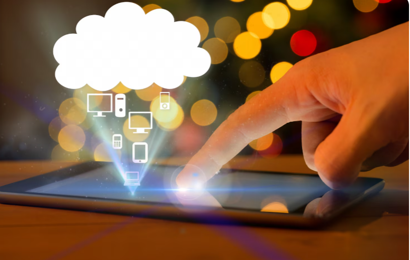 Hand touching tablet screen showing cloud attendance system for employee check-in
