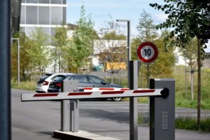 Automatic barrier arm gate controlling vehicle entry at airport security checkpoint
